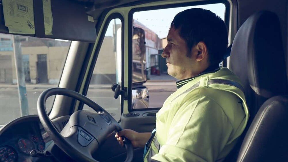 A woman in a yellow vest