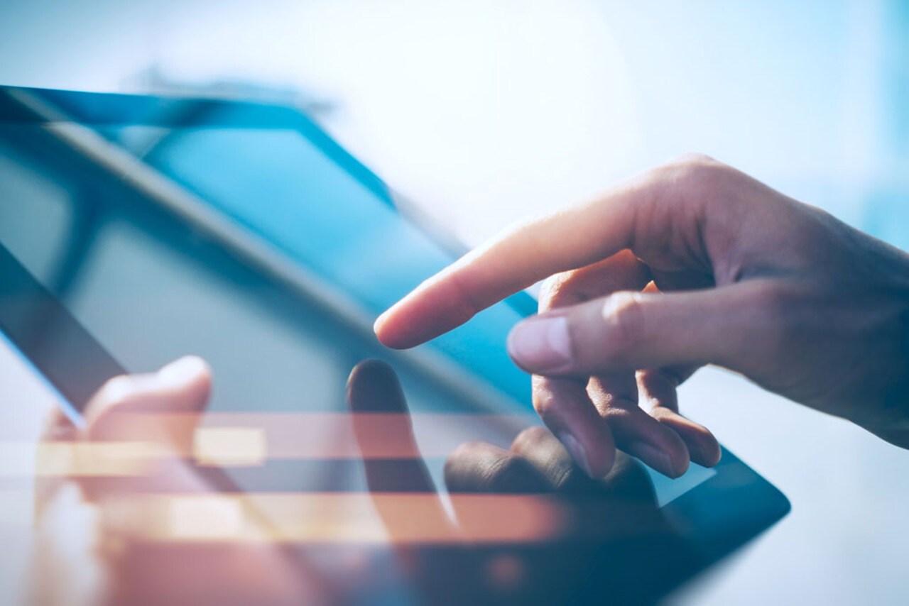 Close up of hands on a tablet
