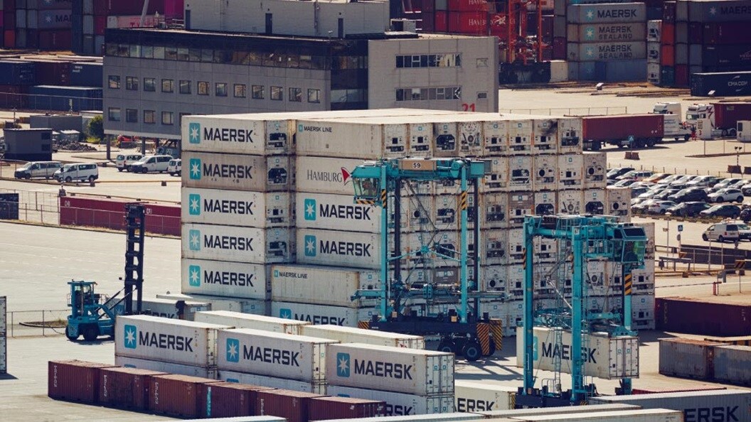 Stacked Maersk containers at port