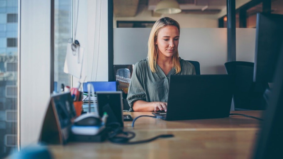 Female working on her laptop in the office