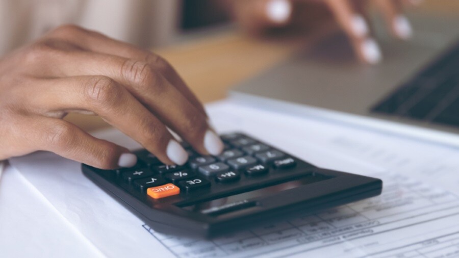 female hand on a calculator