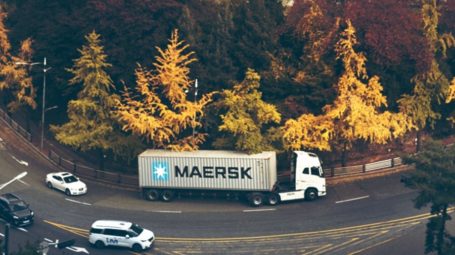 Maersk truck driving along a curved road
