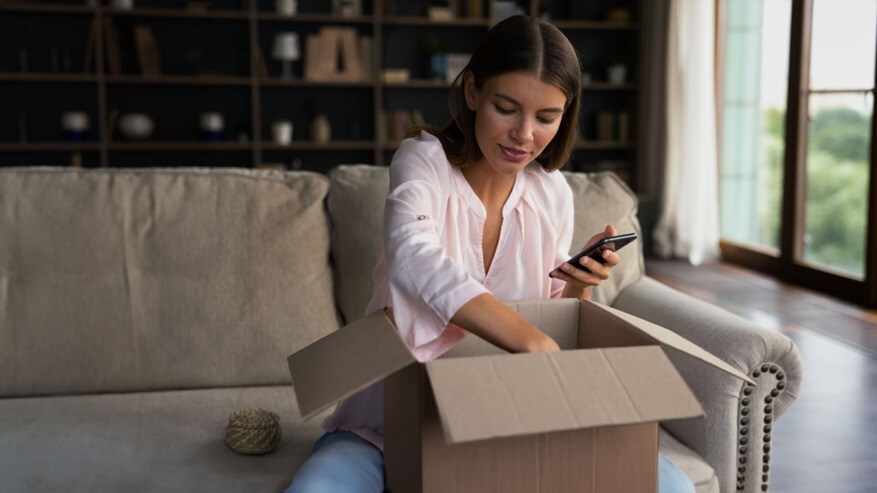 A woman unboxing her parcel
