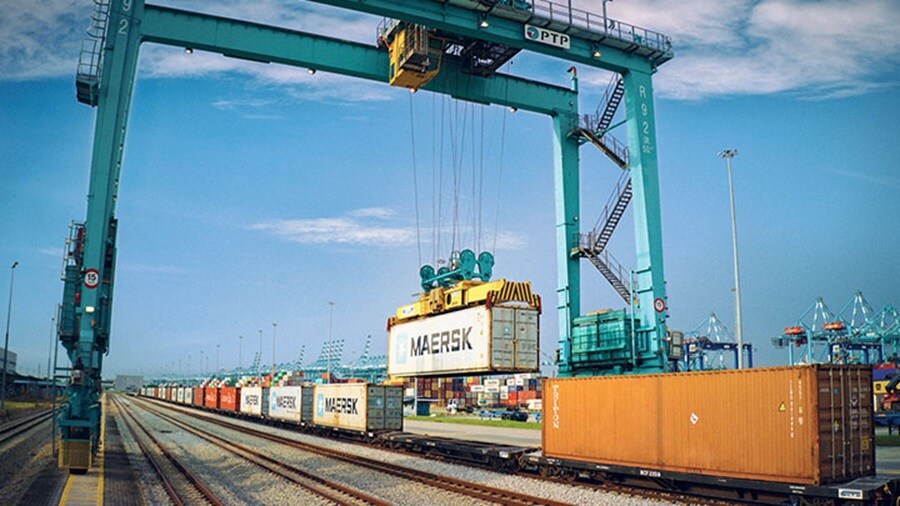 Container being loaded on to train