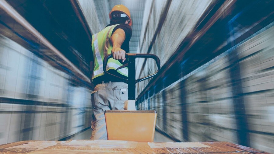 Motion shot of a male in a warehouse