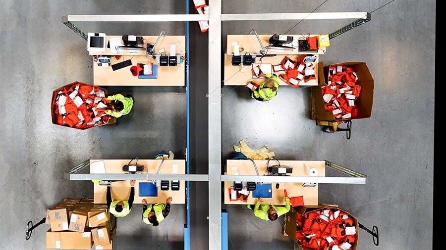 View of ecommerce fulfilment stations in a warehouse.