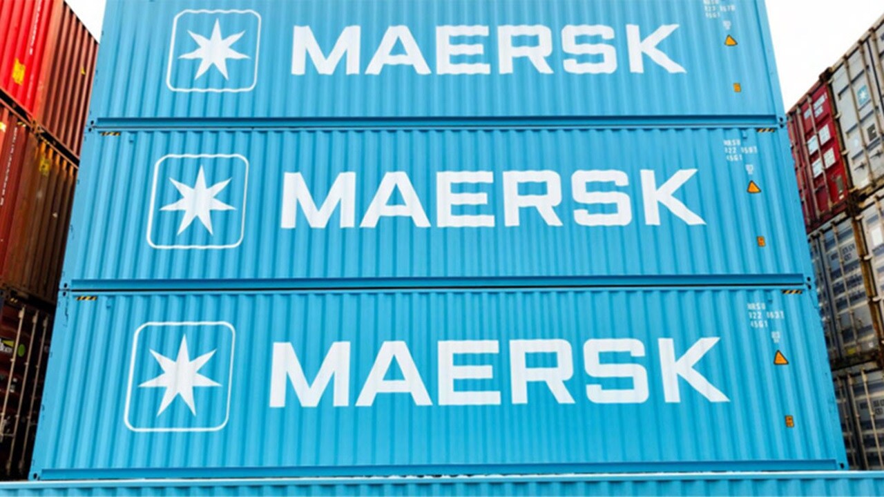 Containers are stacked, each displaying the "Maersk" logo in white.