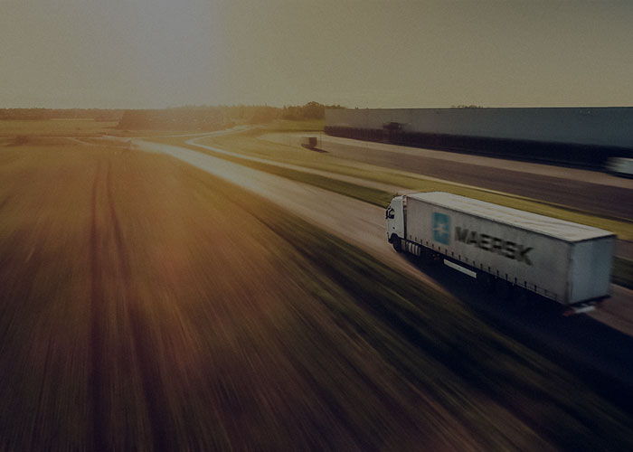 Inland logistics services - A truck carrying Maersk container with inland cargo.