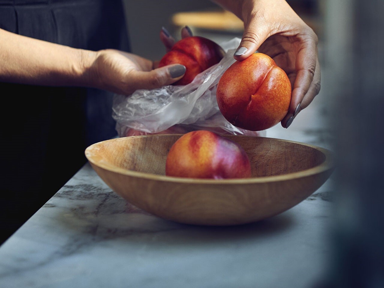 Close up of hands holding fruits