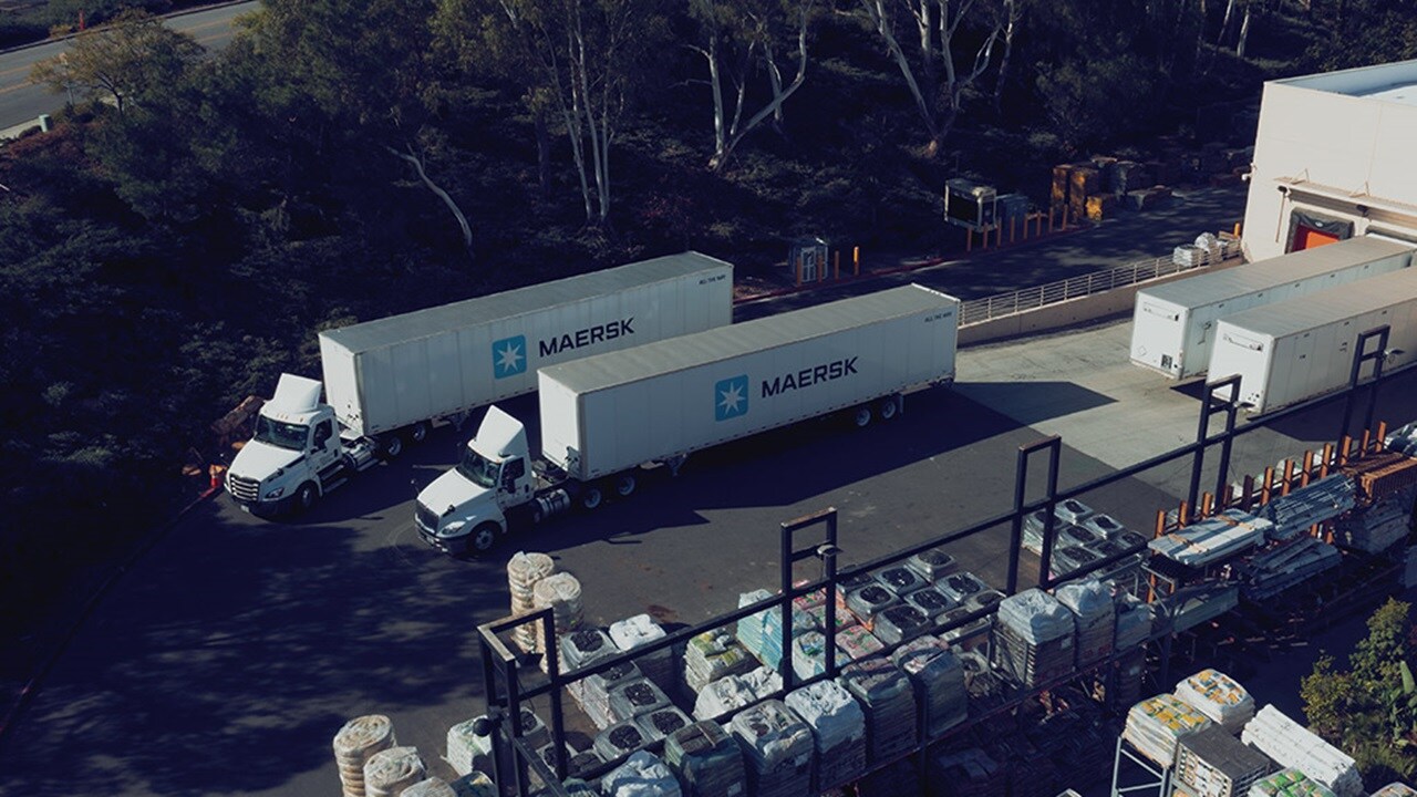 Maersk container trucks parked at the docking station.
