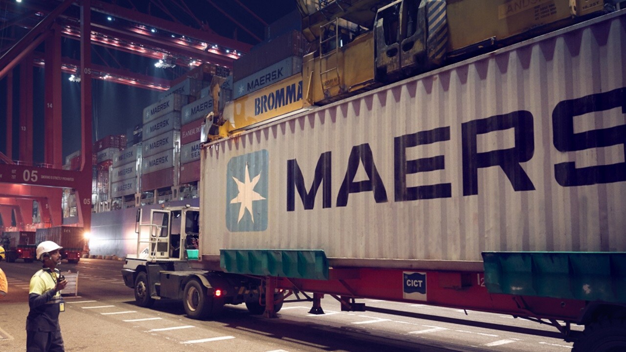 A side view of a Maersk premium container truck designed for safe and secure transport.